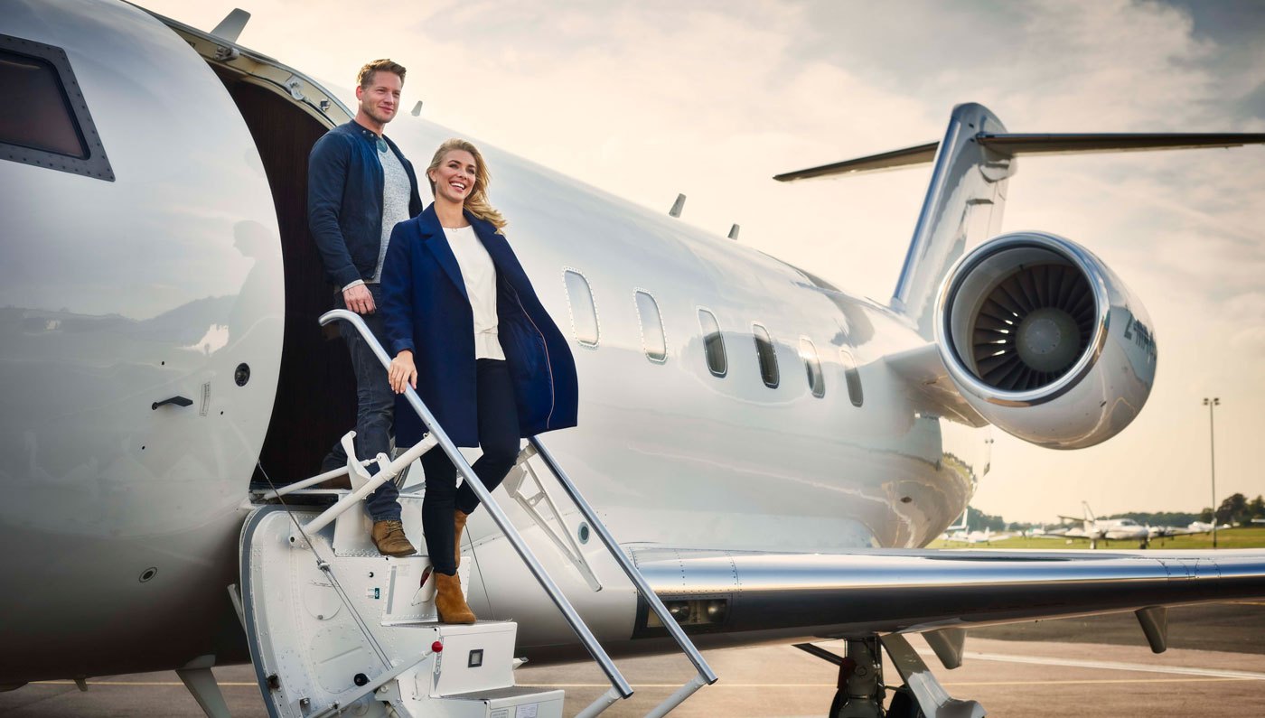 couple in a private jet - Velox Air Charter