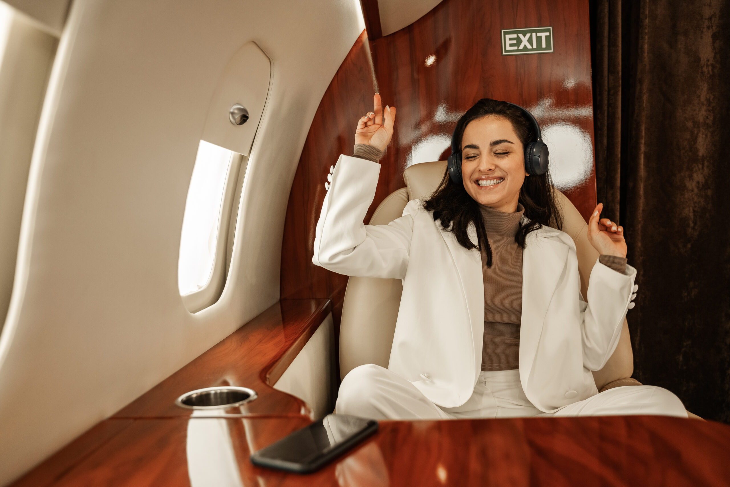 business women inflight of a private jet charter